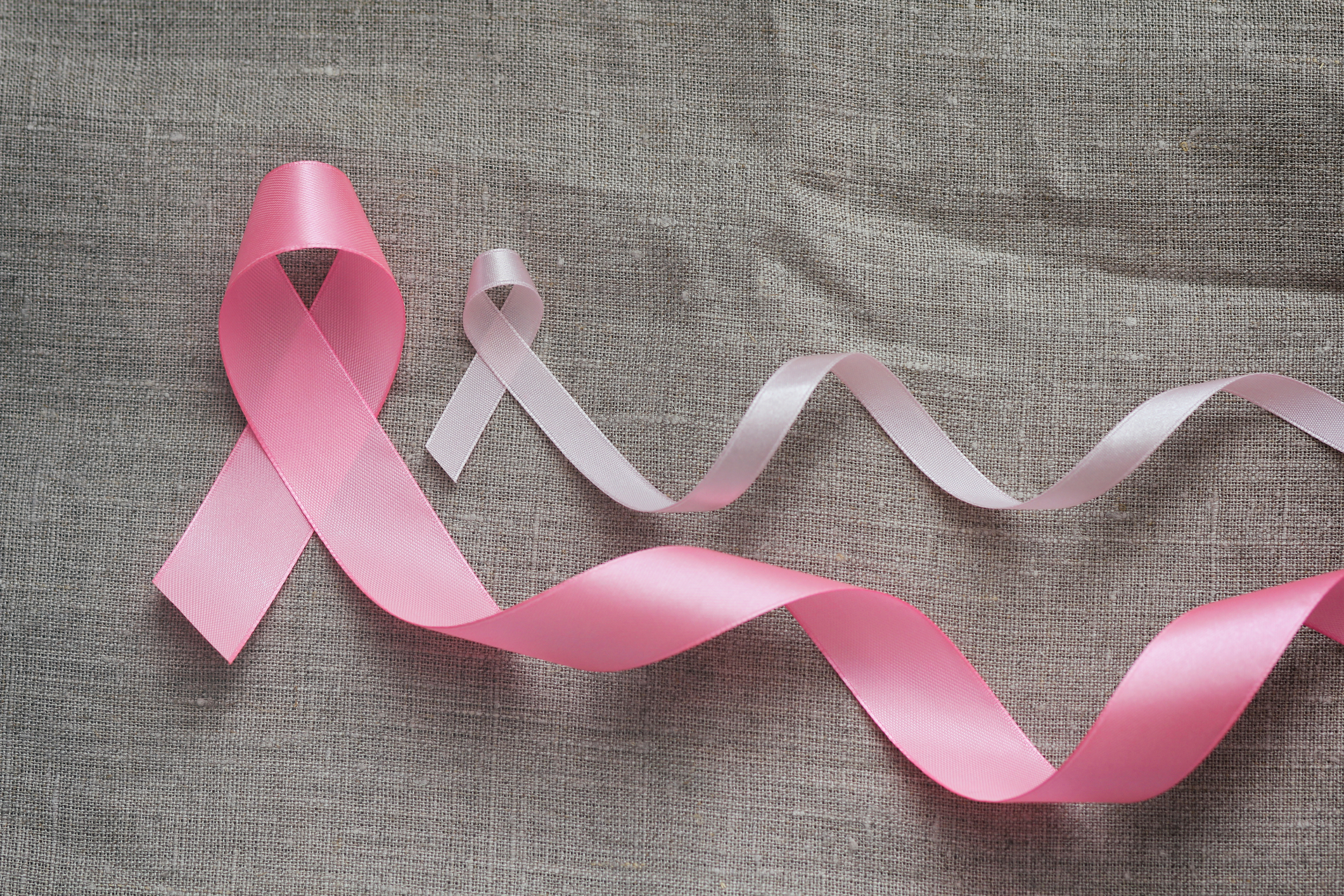 Effective Nutrients for Breast Problems A large and a small breast cancer awareness ribbons.