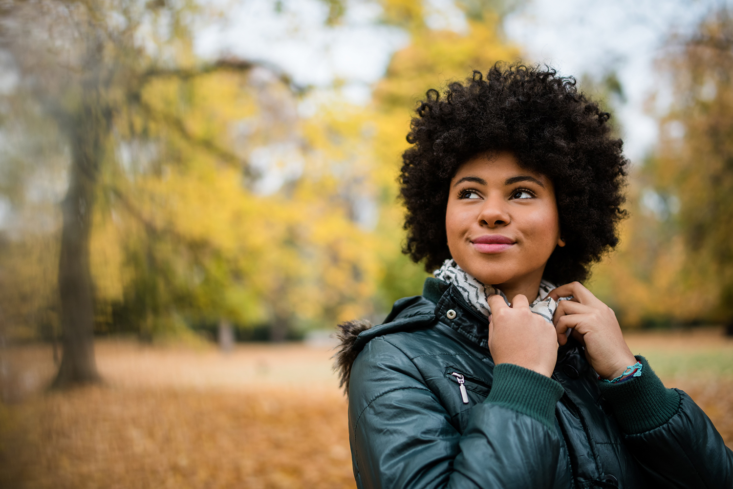 Autumn Immunity Tips to Ward Off Virus & Respiratory Issues Candid shot of a young woman outdoors in autumn.
