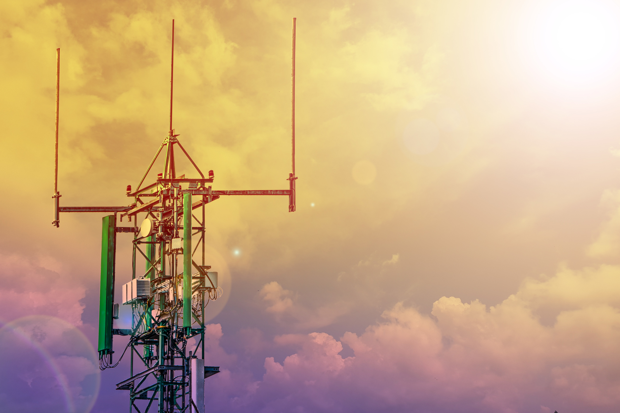 What Everyone Needs to Know About 5G Radiation Communication tower or 4G 5G network telephone cellsite with cloudy sky during sunset.