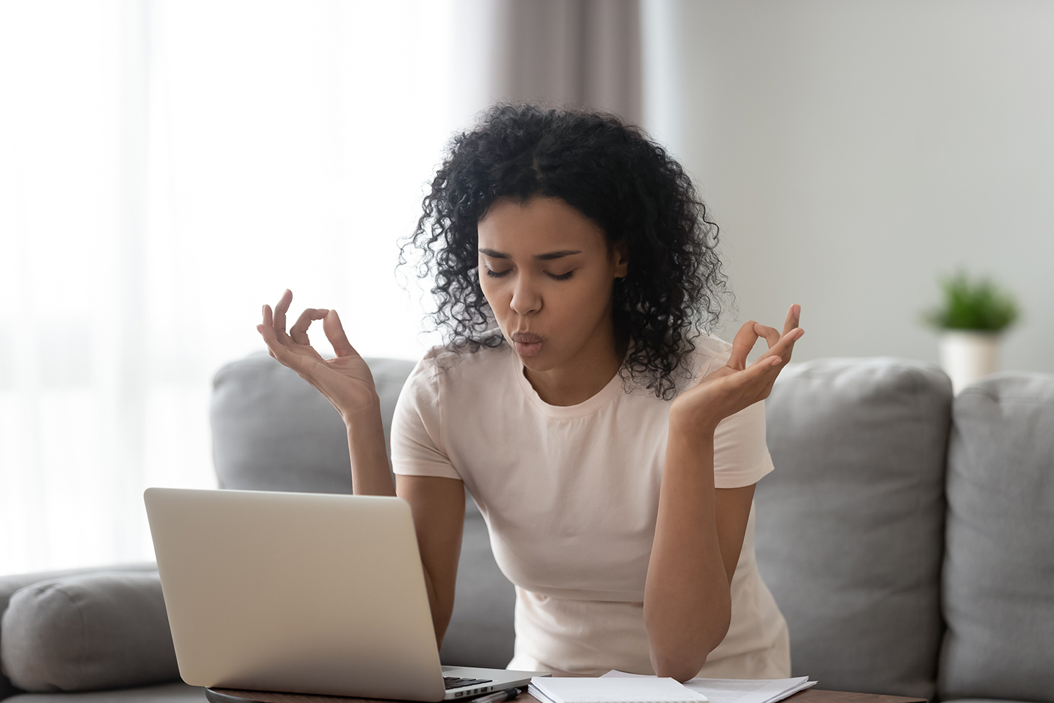 an anxious woman taking a deep breath