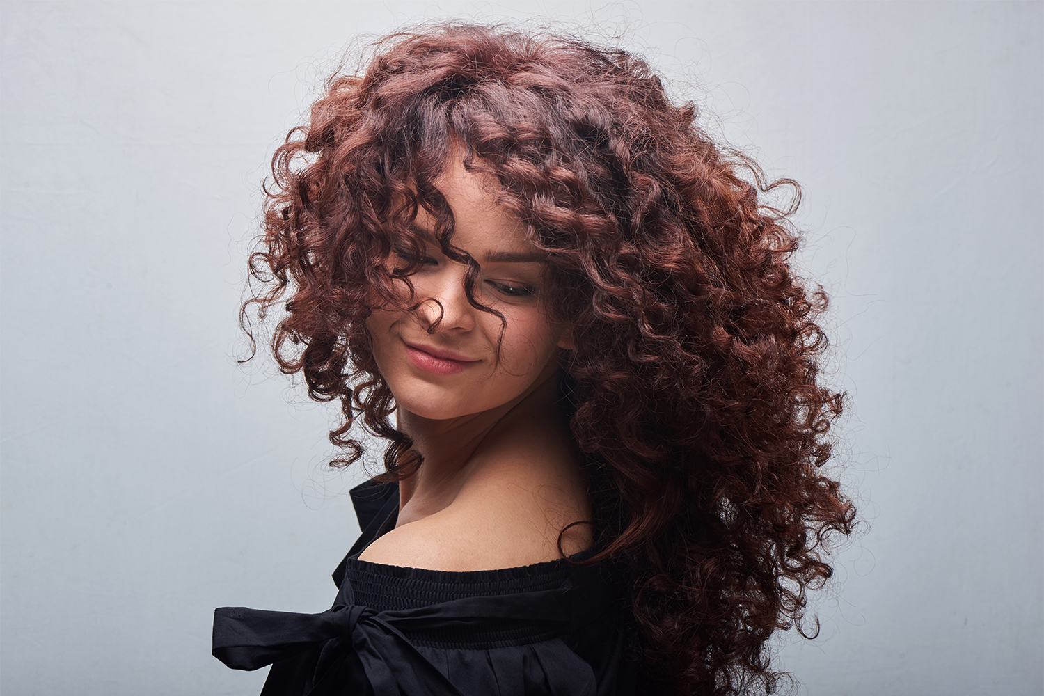 Love Your Curls a woman with luxurious curly hair