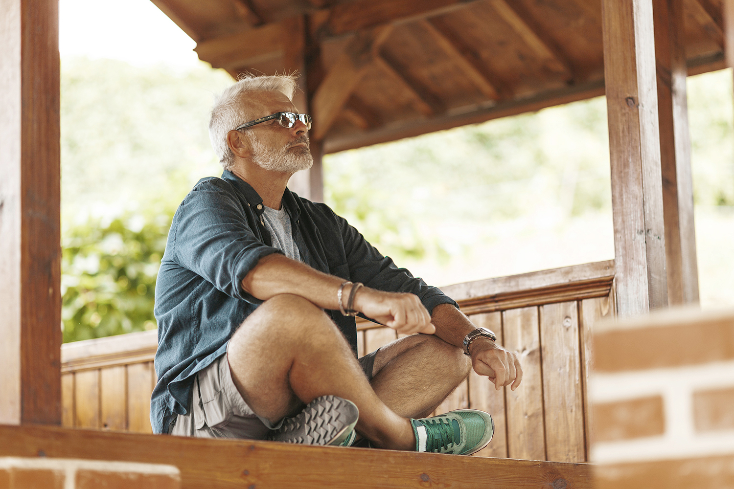 a healthy-looking older man meditating on life