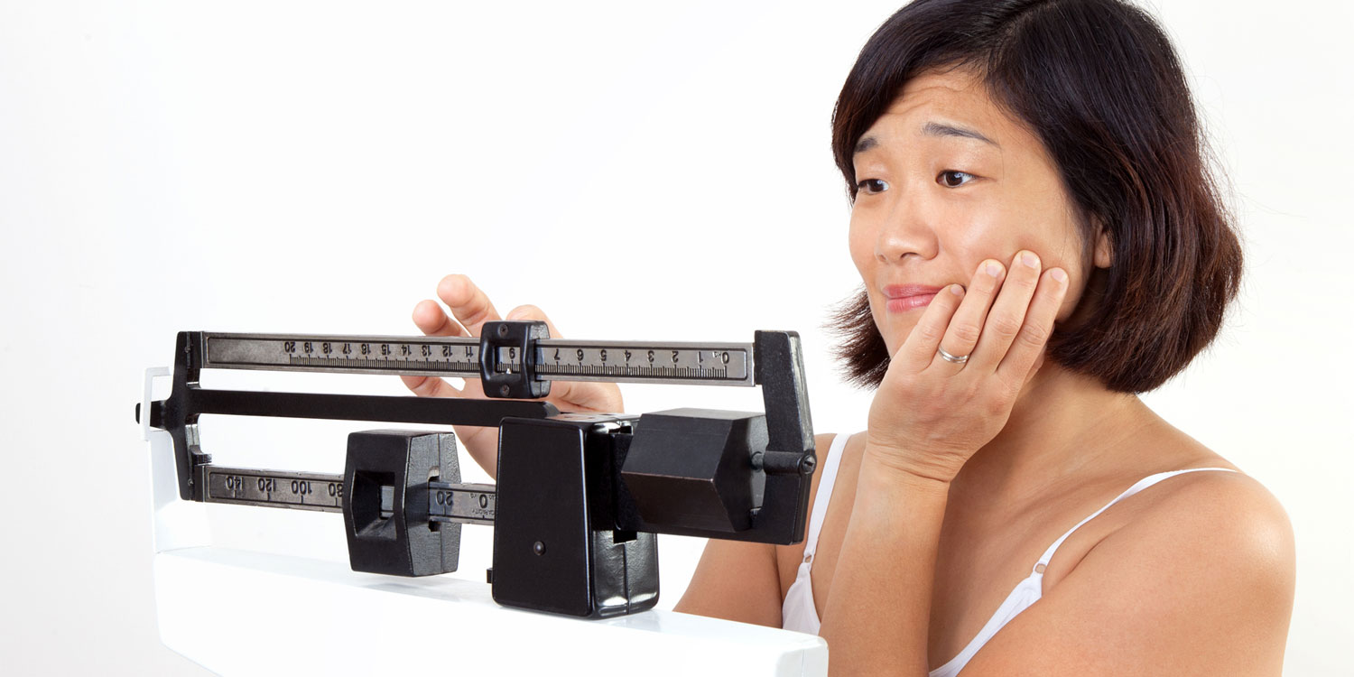 Three reasons you haven’t reached your health goals Disappointed Woman with Weight Goals
