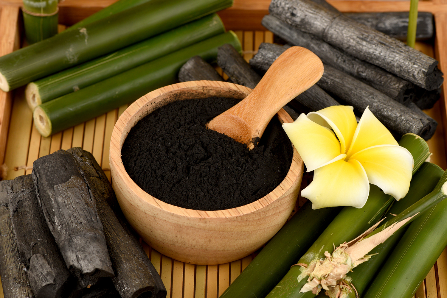 Activated Charcoal in a wooden bowl.