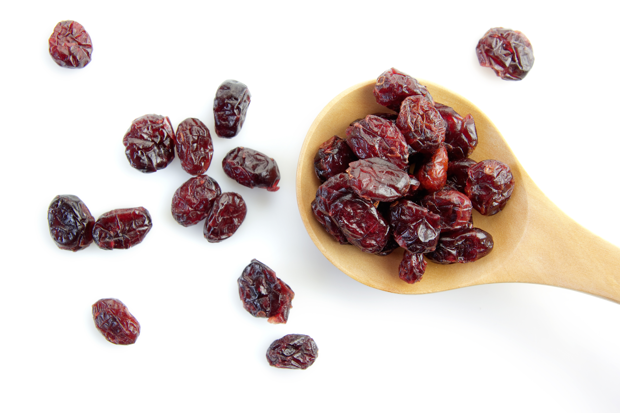 Dried cranberries in a wooden spoon. 