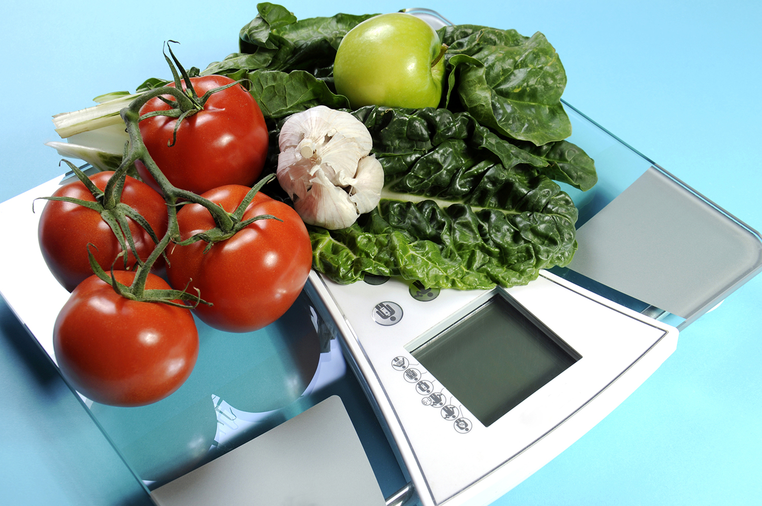 some fresh produce on a bathroom scale