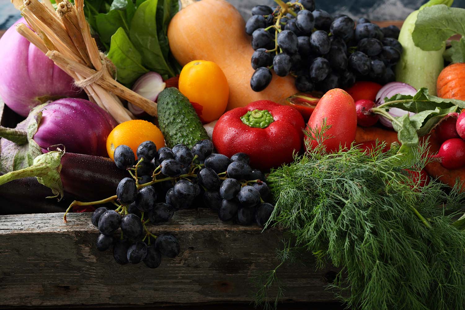 fresh delicious organic produce in a wooden crate