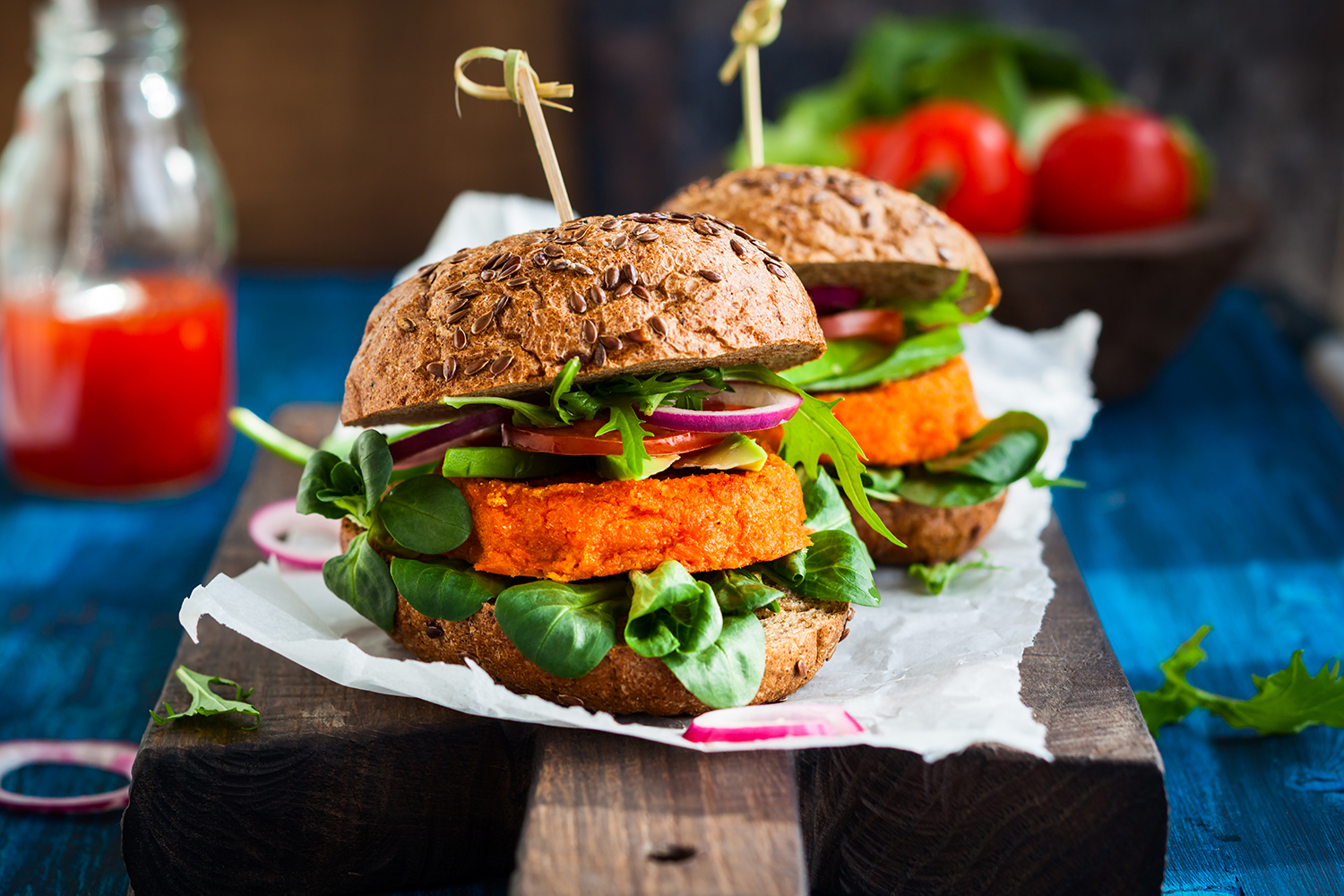 A veggie burger with avocado
