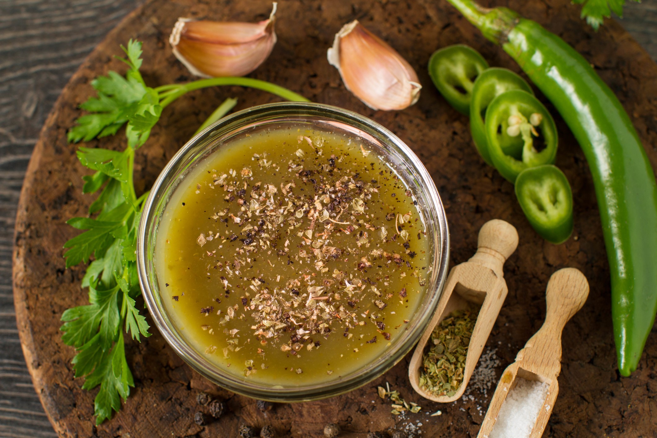 Magic Green Sauce Magic Green sauce in a small glass bowl surrounded by ingredients.