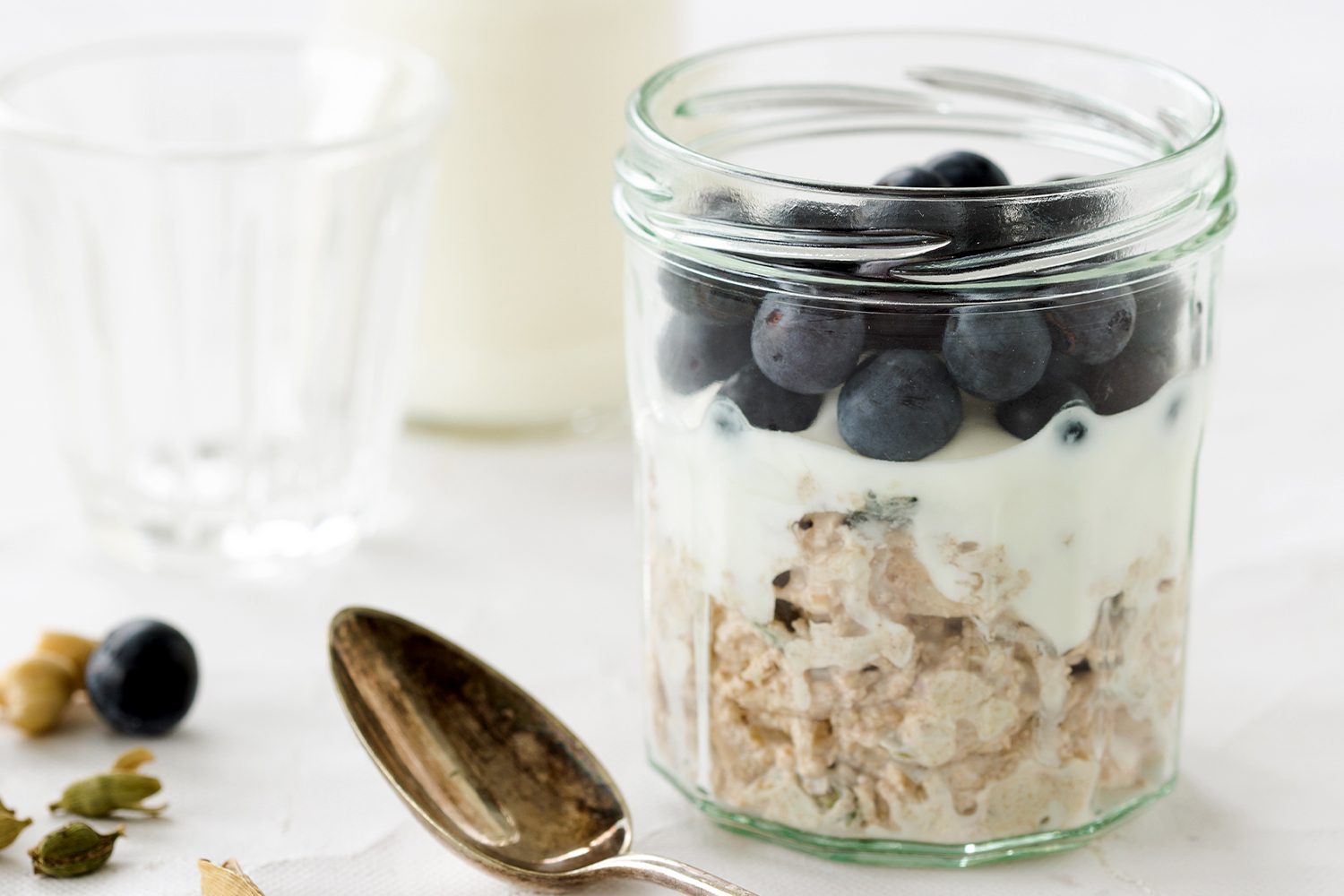 Blueberry Earl Grey Overnight Refrigerator Oats a jar of oats, blueberries, and milk