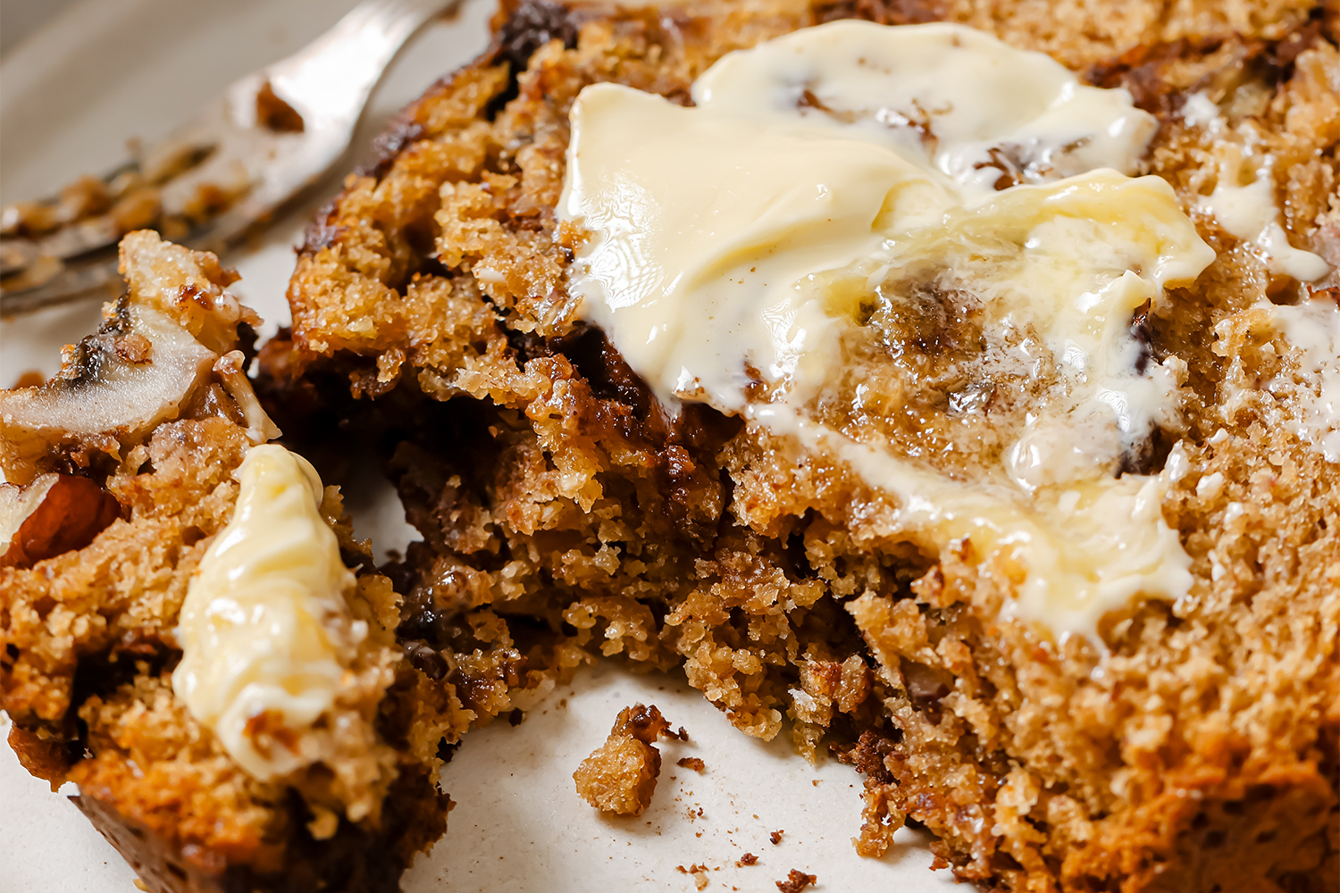 Cinnamon Swirl Banana Bread a slice of banana bread slathered with cinnamon and butter
