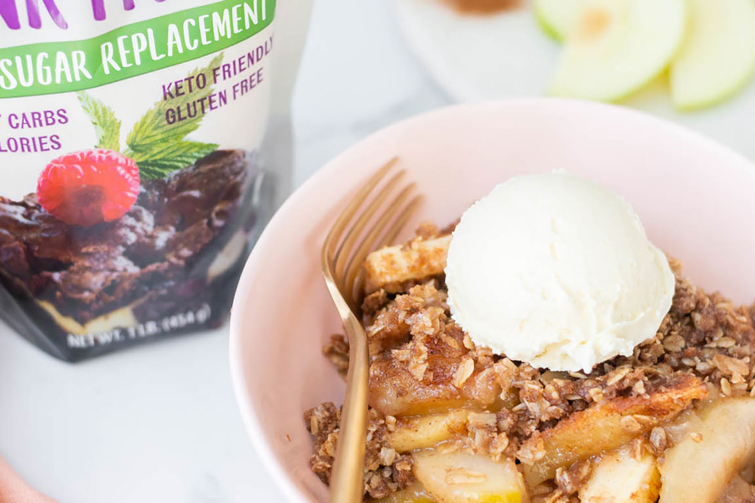 a bowl of apple crisp topped with vanilla ice cream
