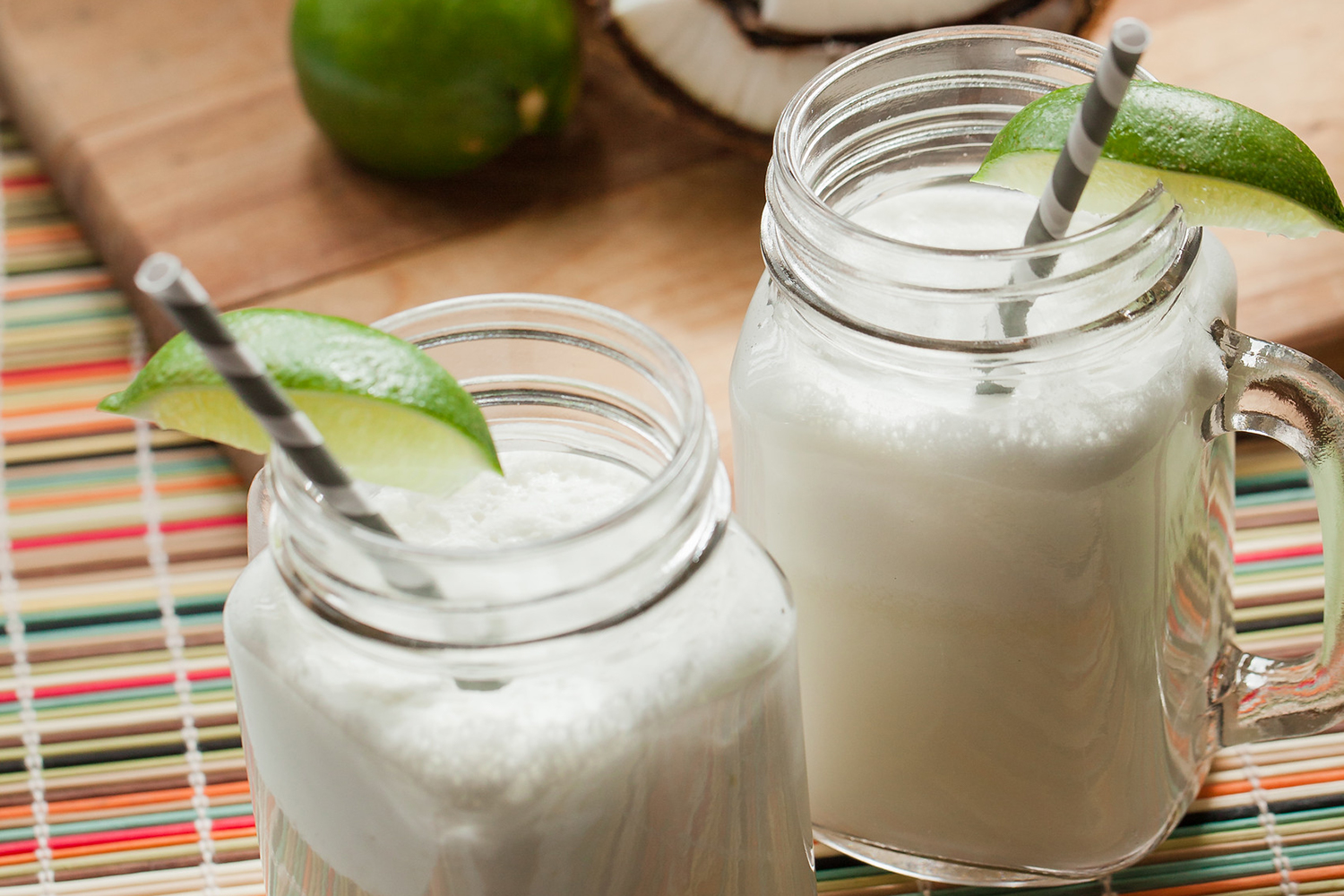 Coconut Cooler Two mug-handle mason jars full of coconut-lime cooler