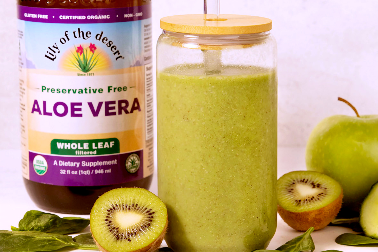 Glow Aloe-ver Smoothie a green smoothie next to a bottle of whole leaf aloe vera