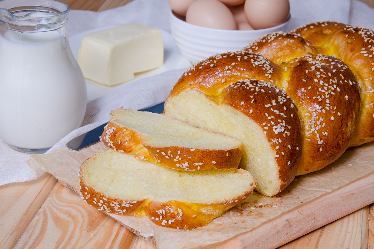 a freshly baked loaf of traditional braided challah bread