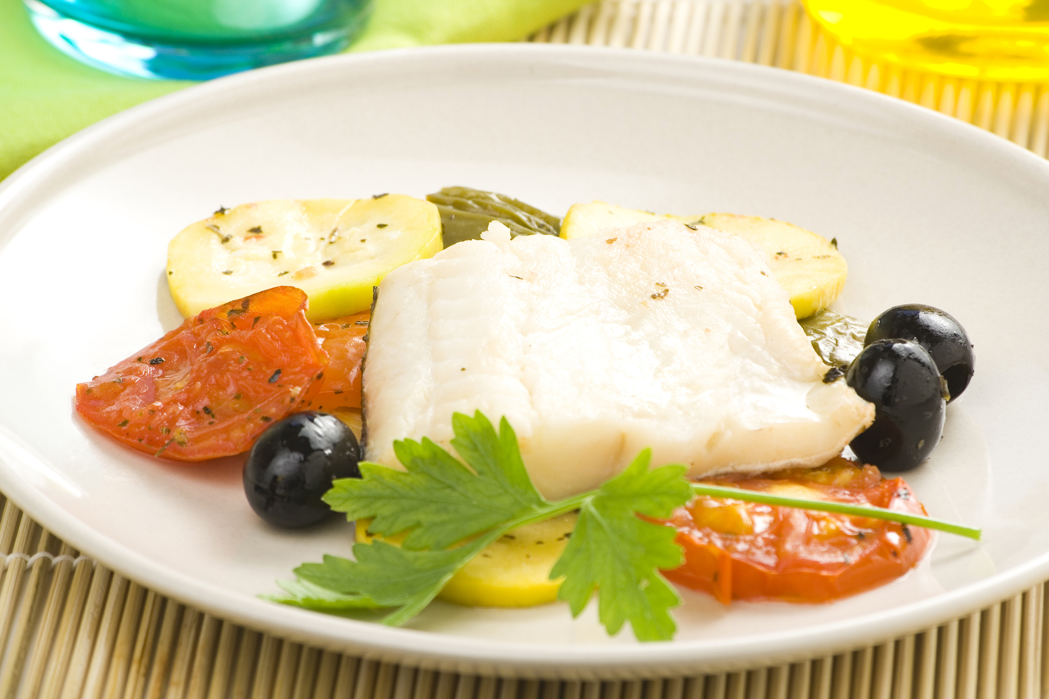 Mediterranean Baked Cod Fillet of cod baked tomatoes and black olives.