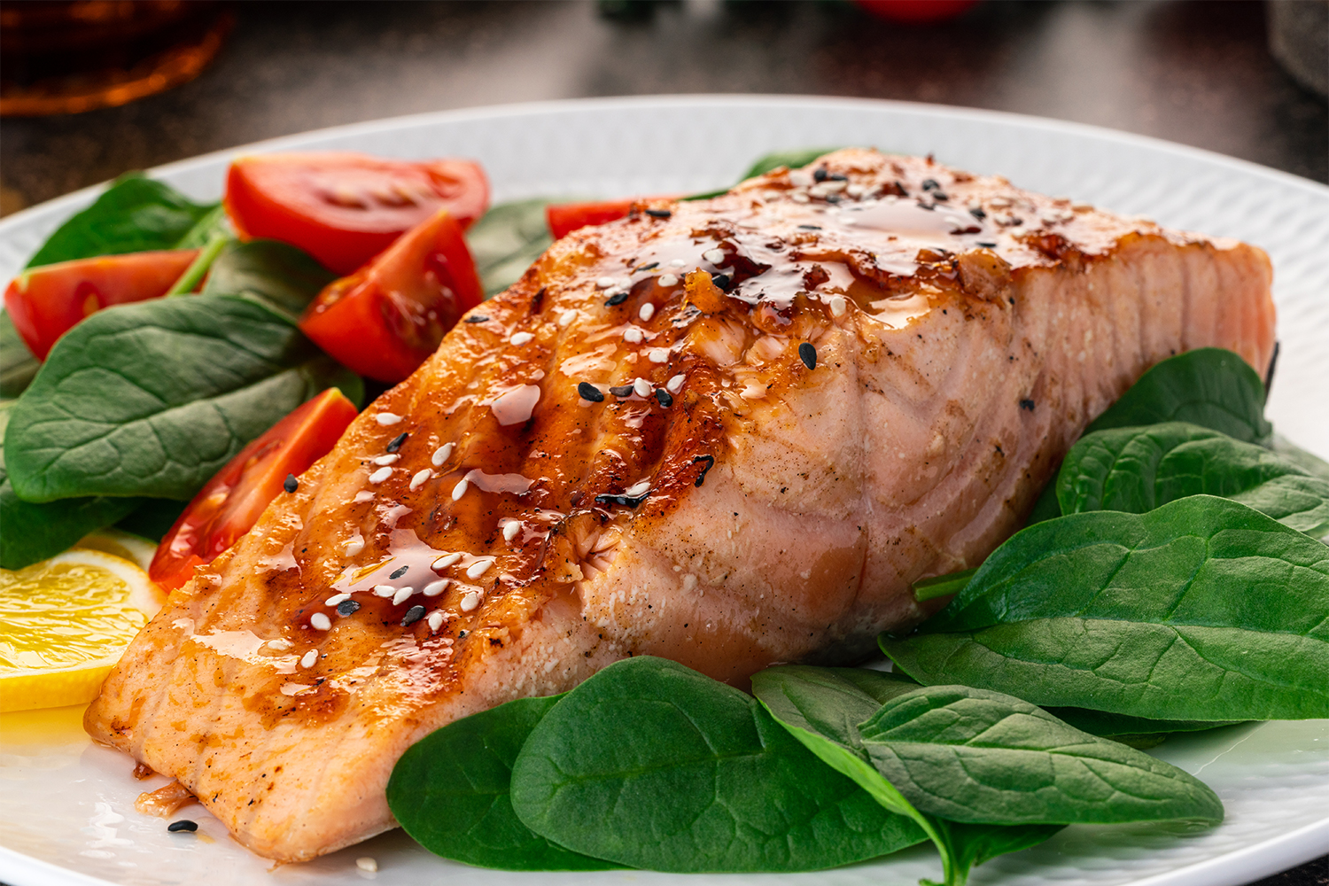 roasted salmon on a bed of greens