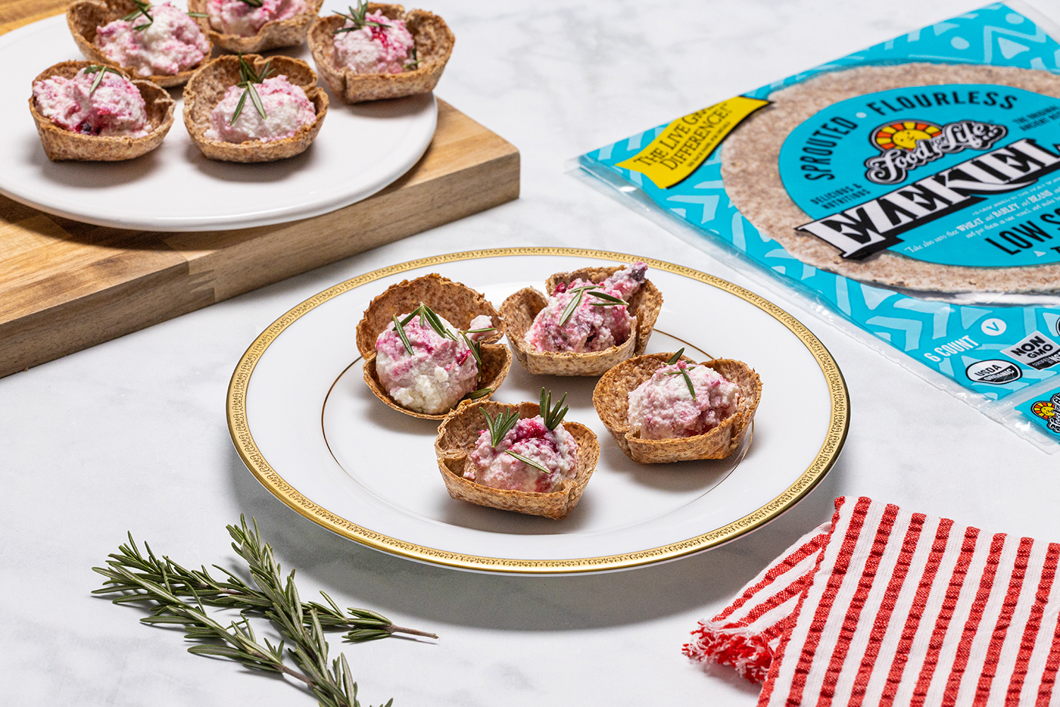 Mini Rosemary and Cranberry Goat Cheese Bites goat cheese with cranberries on tortilla chips
