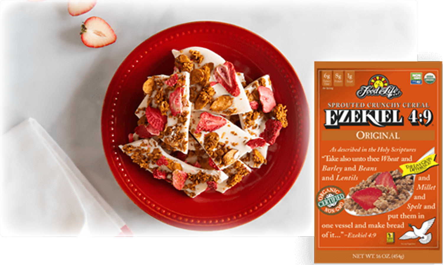White Chocolate Strawberry Almond Granola Bark a box of cereal and a bowl of white chocolate bark with berries