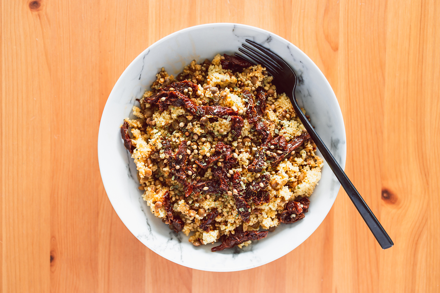 Couscous Salad with Black Lentils a bowl of couscous with lentils and veggies