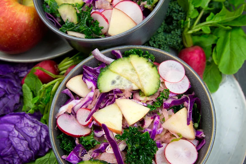 Red Cabbage Sauerkraut Slaw a bowl of slaw with crisp ingredients