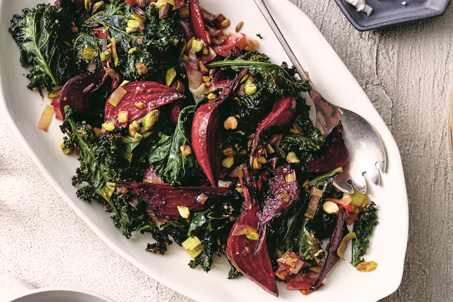 Roasted Beet, Leek, and Kale Salad a plate of roasted vegetables with dressing