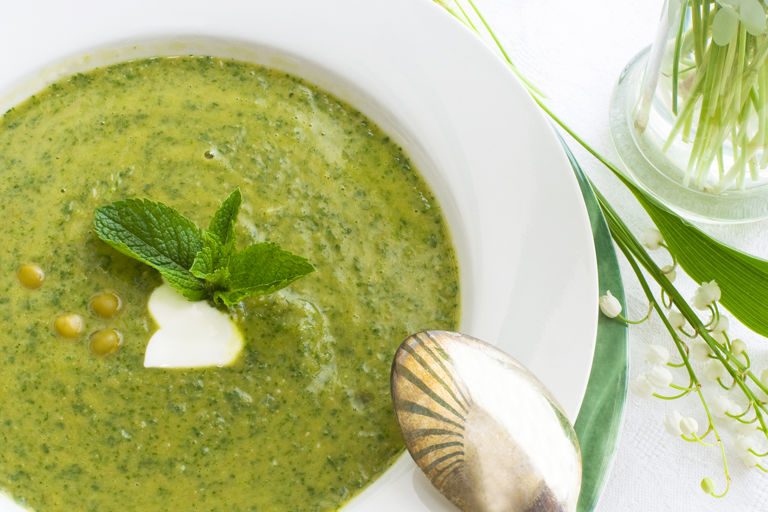 Spring Pea Soup with Mint a bowl of pureed pea soup with mint