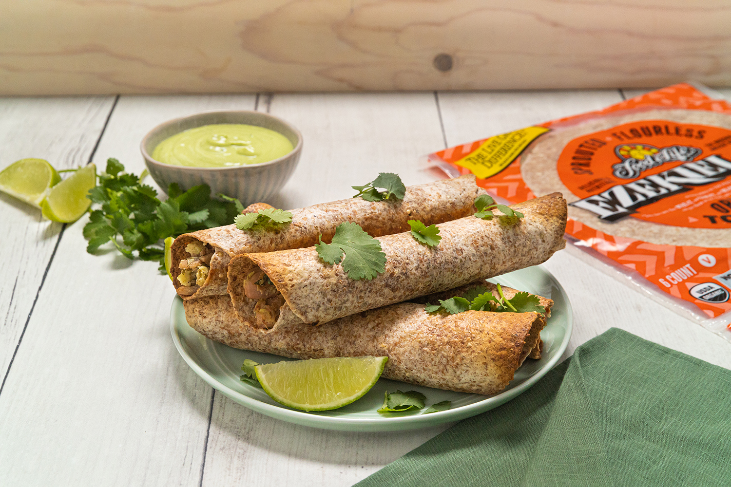 Baked Jackfruit Avocado Taquitos a plate of vegan taquitos and a package of tortillas