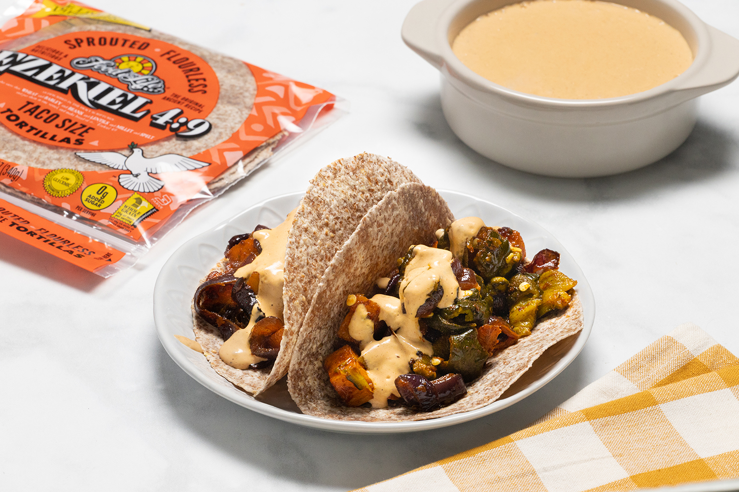 Roasted Poblano and Butternut Squash Tacos a plate of vegan tacos with peppers and squash