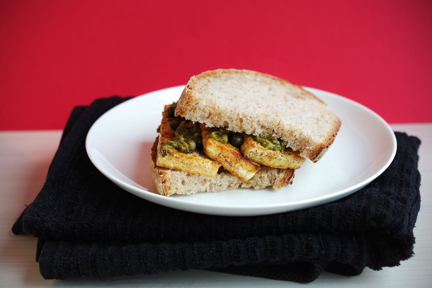 Smoky Miso Tofu Sandwiches a tofu sandwich on a plate