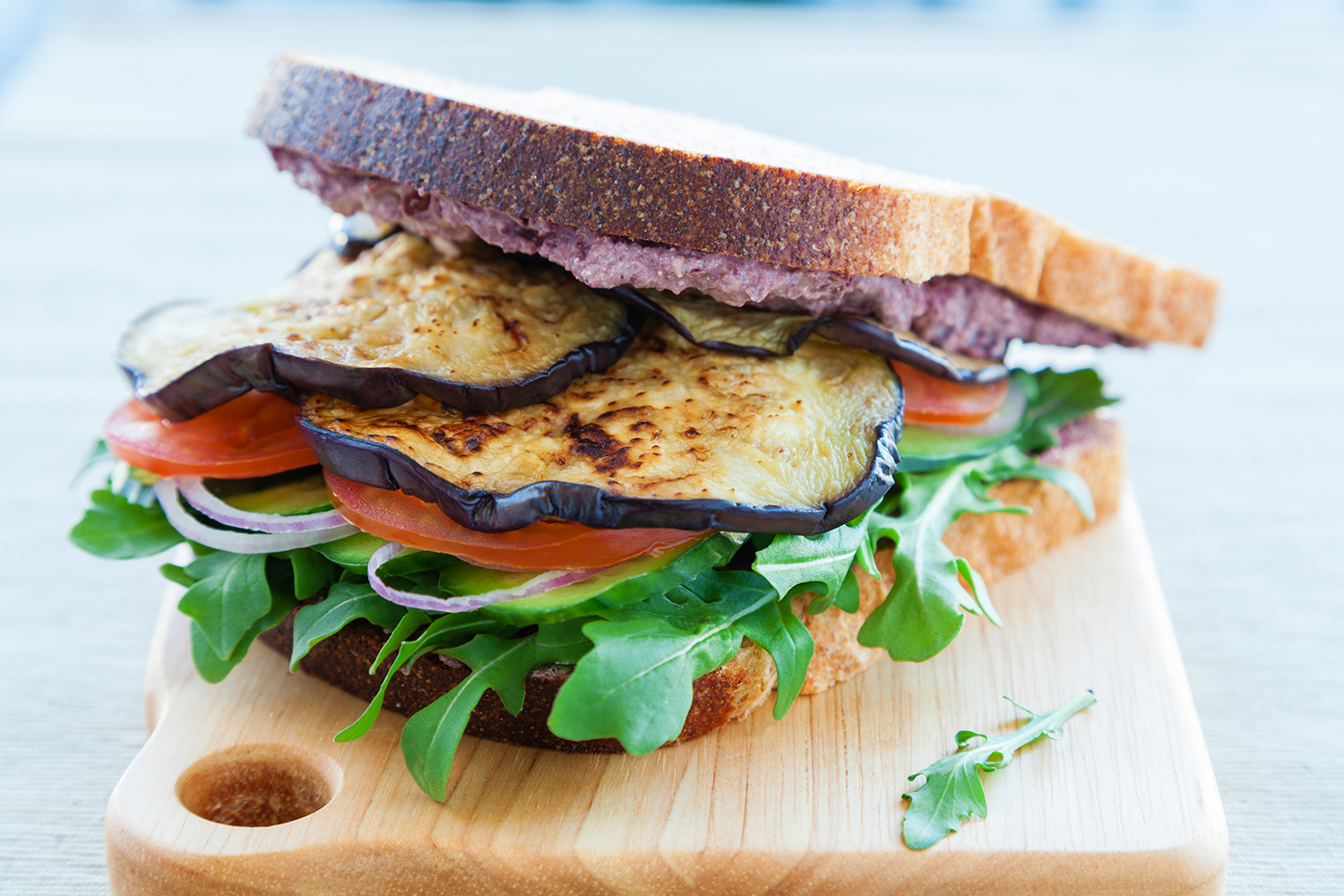 Grilled Eggplant and Tomato Sandwiches grilled eggplant on bread with crumbled cheese