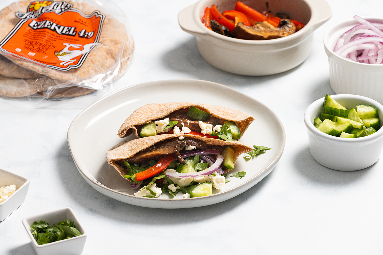 Oven-Roasted Portabella Mushroom Gyro a pita pocket stuffed with portabella mushrooms and veggies