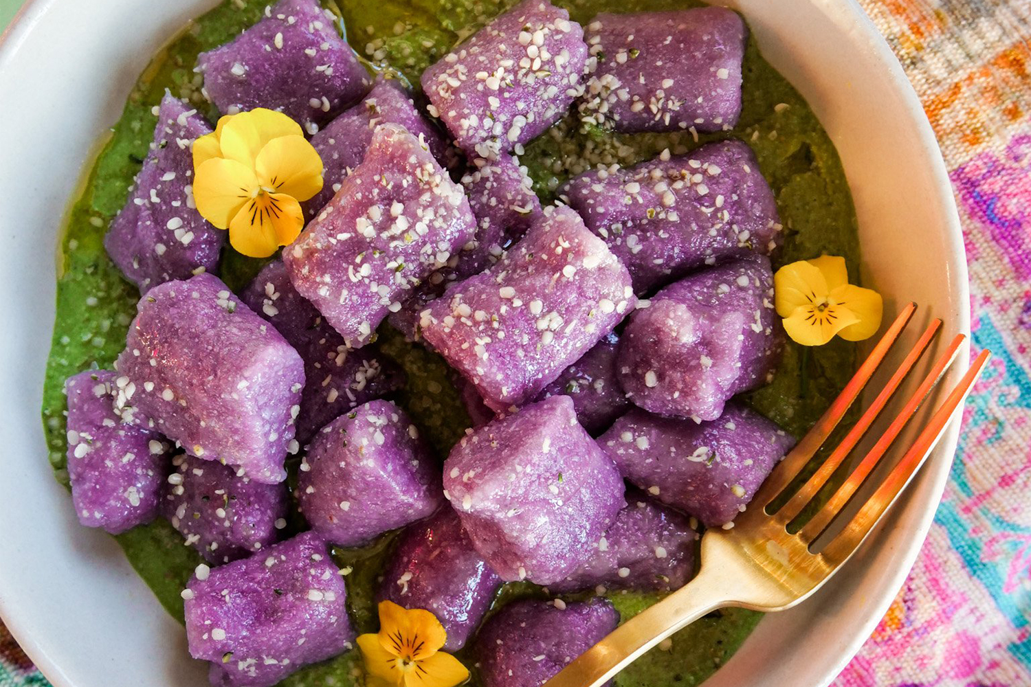 Purple Cauliflower Gnocchi a bowl of cauliflower gnocchi on greens