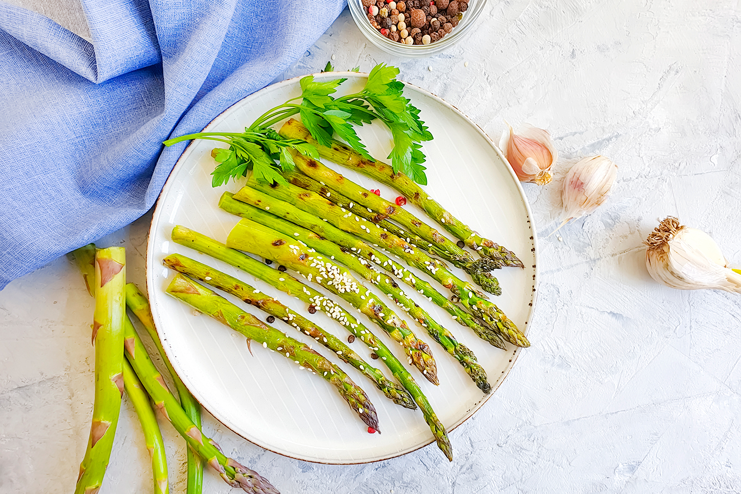 Roasted Asparagus with Garlic a plate of asparagus with garlic