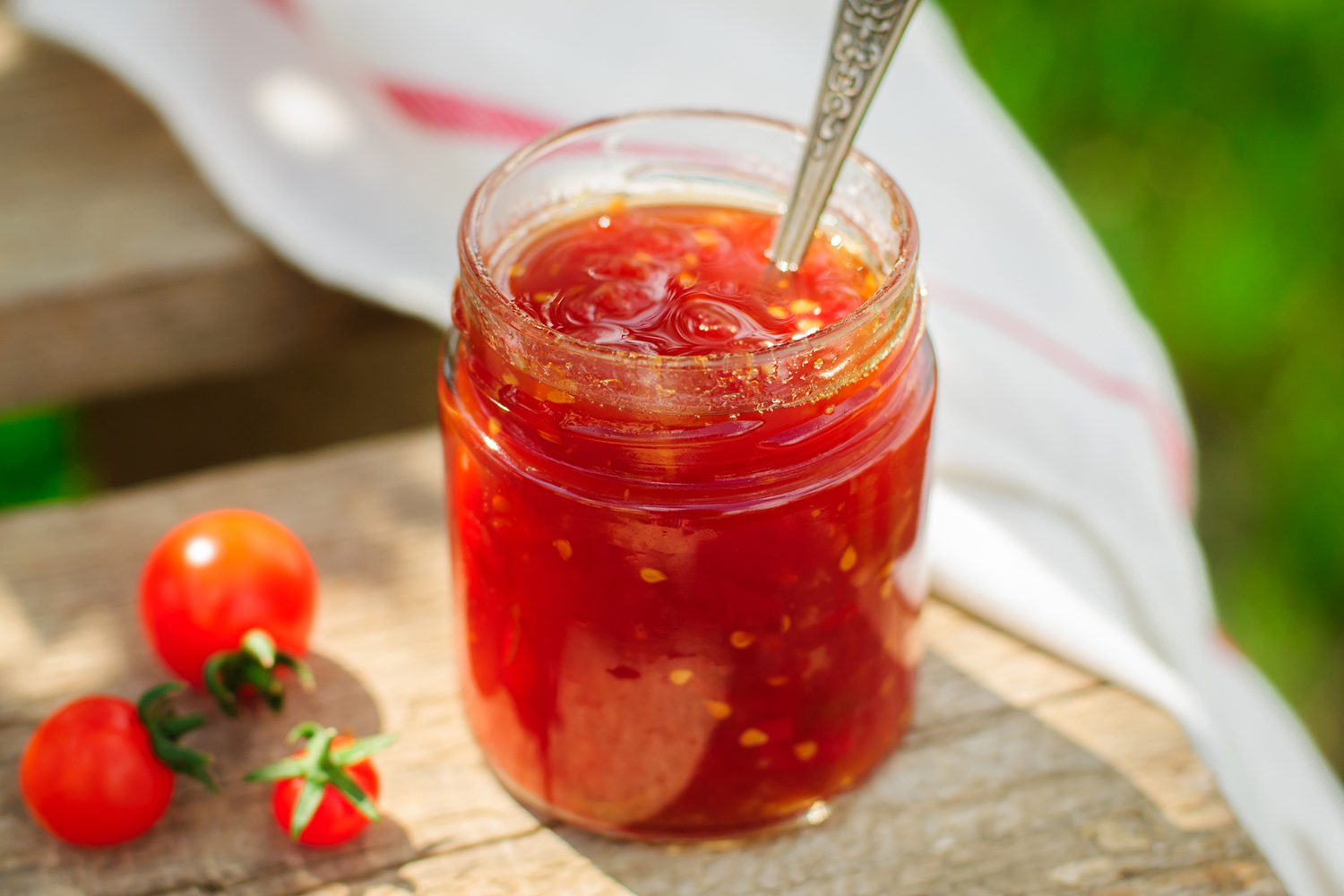 Tomato Jam a mason jar full of reduced tomatoes