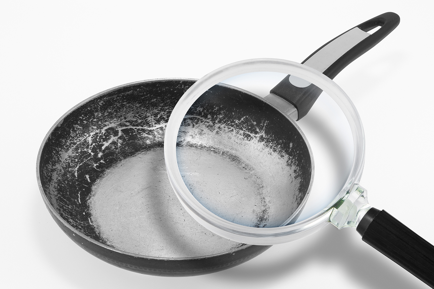 a non-stick pan under a magnifying glass