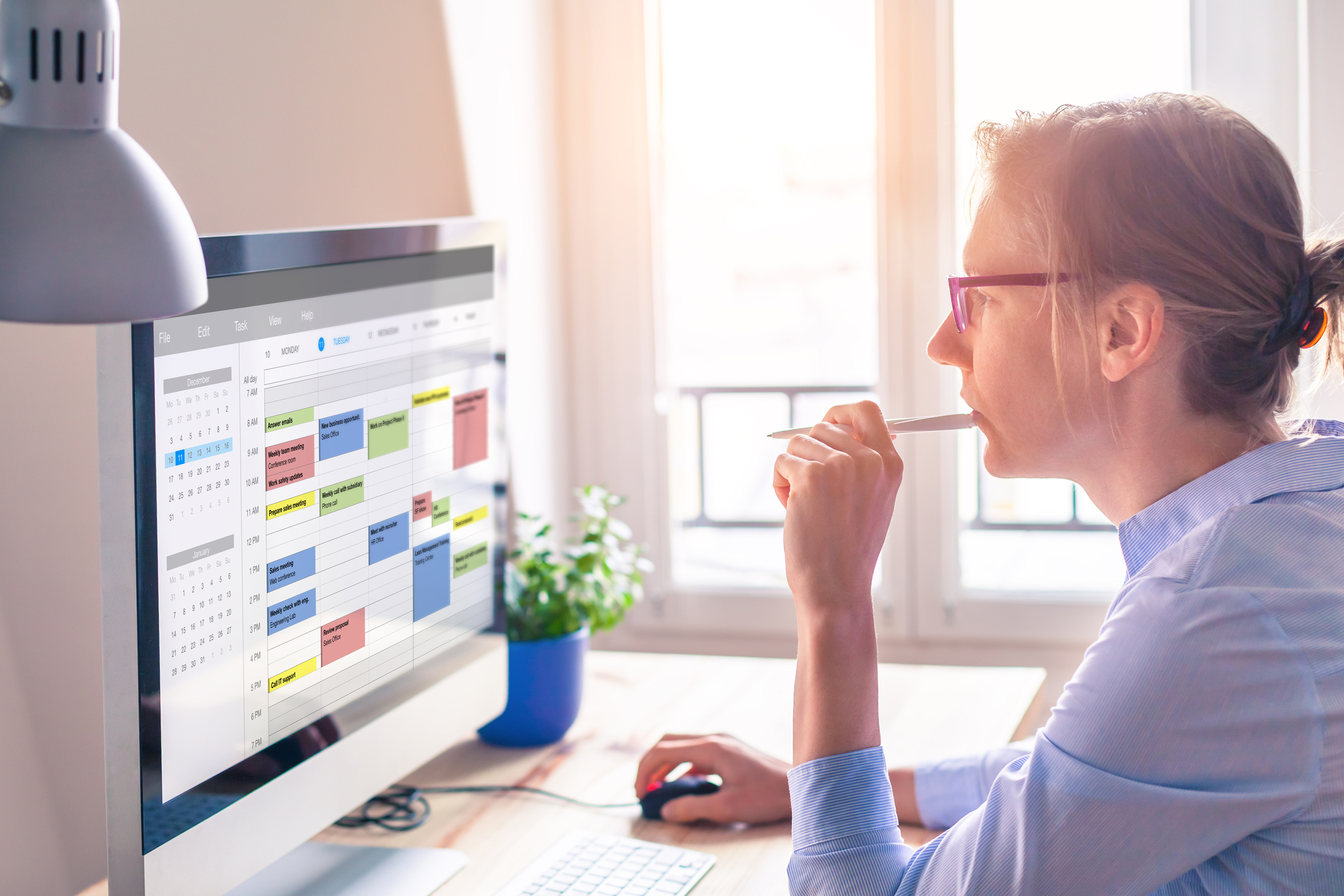 Person looking at their schedule on a computer. 