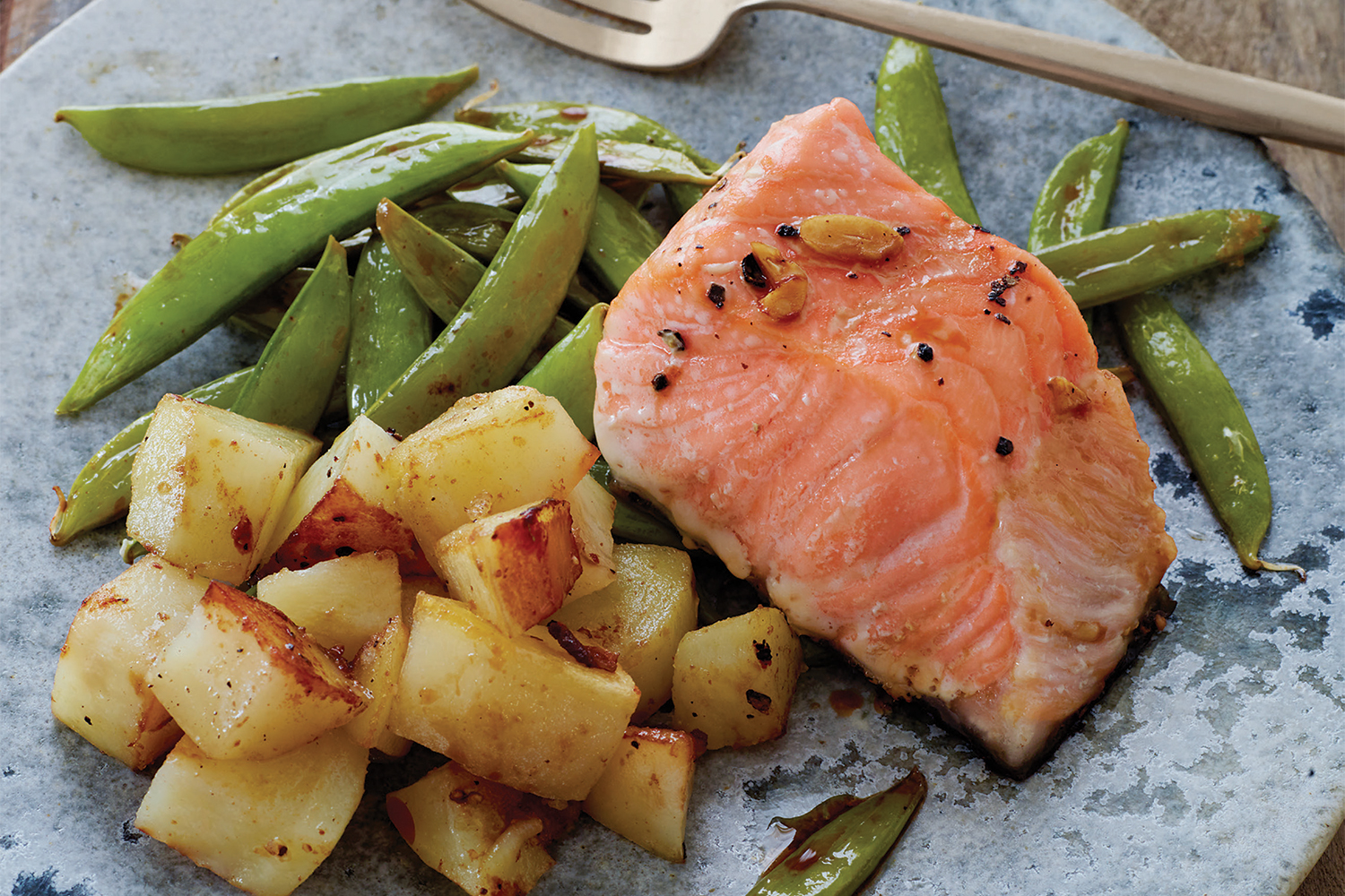 One-Sheet Asian Salmon, Snap Peas, and Potatoes Salmon plated with snap peas and potatoes