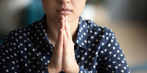 s woman in calm and meditative prayer