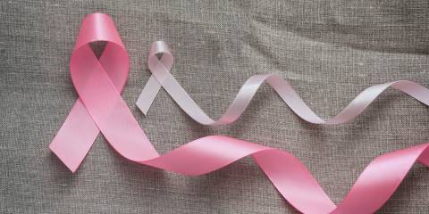 Effective Nutrients for Breast Problems A large and a small breast cancer awareness ribbons.