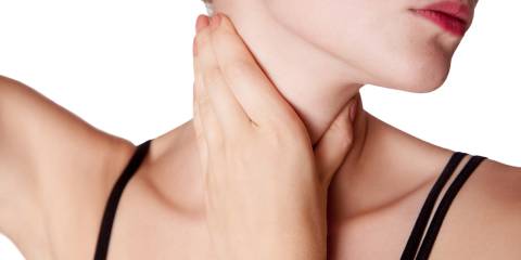 Weight Loss, Energy, and Mood: The Thyroid Connection Closeup view of a young woman with pain on neck or thyroid gland.
