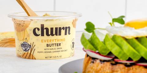 a tub of butter and a delicious toast