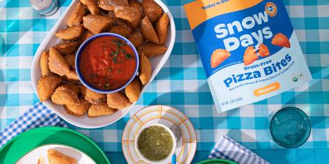 pizza bites being served with sauce