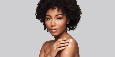 Moisturize Dry Skin Naturally Woman rubbing lotion on her skin
