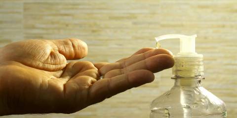 A man putting product on his hands