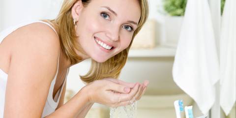 The Magic of Exfoliation Woman washing her face