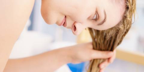 Viola Hair Rinse a woman rinsing out her hair in the sink