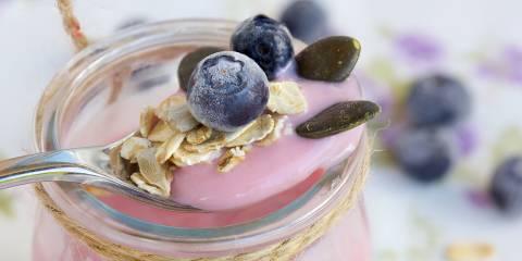 The Brain Benefits of Probiotics probiotic yogurt in a jar with antioxidant blueberries
