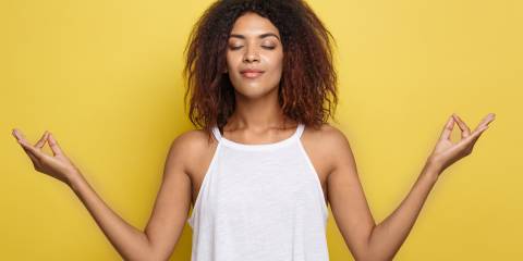 Yogic Breathing May Sharpen Mind A woman doing yoga.