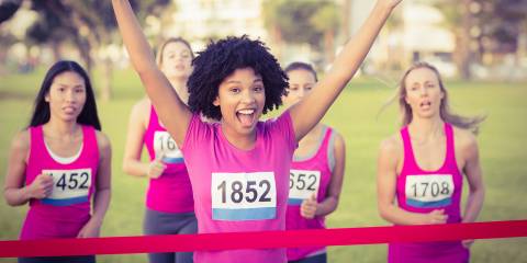 a young woman running against breast cancer